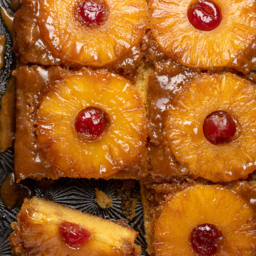 Pineapple Upside-Down Cake is sticky, sweet, and so delicious! This version serves a crowd and is easy enough to whip up on a weeknight! Delicious with a scoop of vanilla ice cream on top!