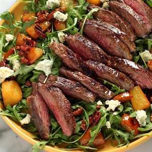Arugula Skirt Steak Salad with Caramelized Pears, Pecans, and Gorgonzola
