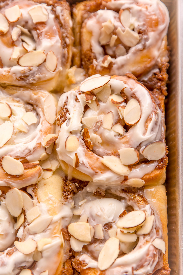 Triple Almond Cinnamon Rolls are the ultimate breakfast treat! This indulgent recipe features soft and fluffy yeasted buns that are filled with brown sugar cinnamon filling and topped with a sticky sweet glaze and slivered almonds! This homemade almond cinnamon roll recipe is a MUST for all of the almond lovers out there!