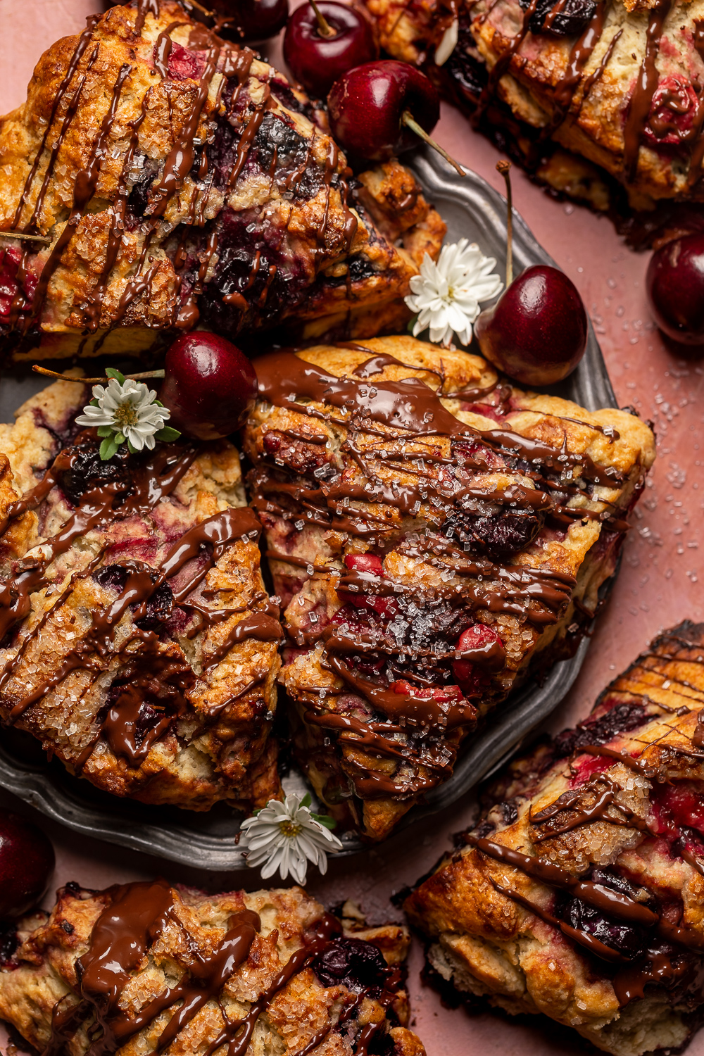 Golden brown, loaded with juicy cherries, and drizzled with dark chocolate, these Chocolate Covered Cherry Scones are a total showstopper! Perfect for breakfast or brunch and so good with a cup of coffee! For an extra chocolate kick, add a 1/2 cup of mini chocolate chips!