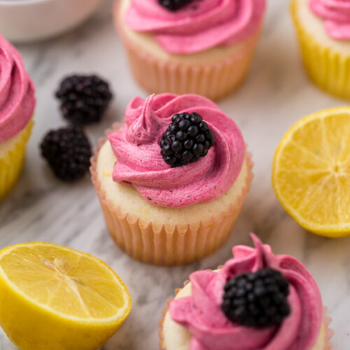 Fluffy Lemon Cupcakes are topped with BLACKBERRY Buttercream! These Lemon Blackberry Cupcakes are so pretty and always a showstopper. Their refreshing flavor makes them perfect for Spring and Summer celebrations!