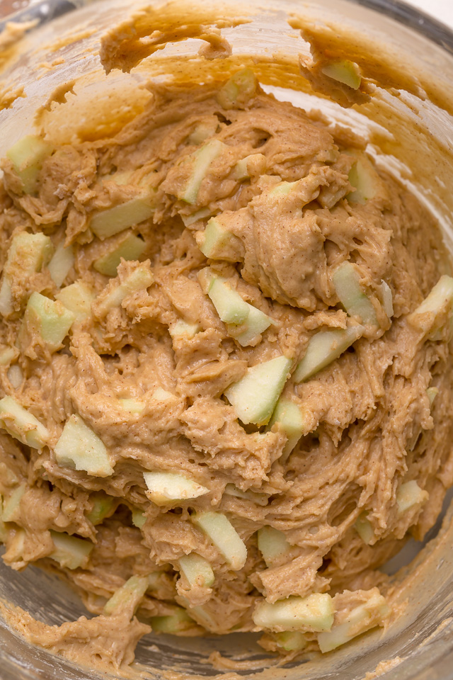 Apple muffin batter with fresh apple pieces mixed into the mixing bowl.
