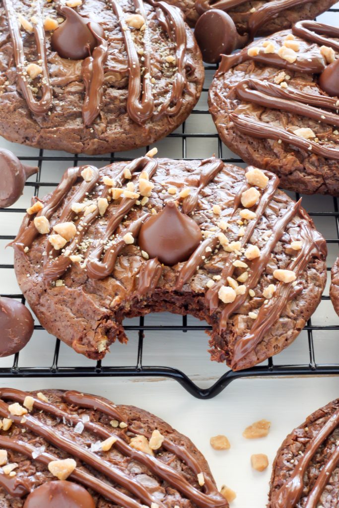Double Chocolate Kiss Cookies - Thick and Chewy Double Chocolate Cookies are topped with a chocolate drizzle, toffee bits, and a chocolate kiss! A chocolate lovers dream.