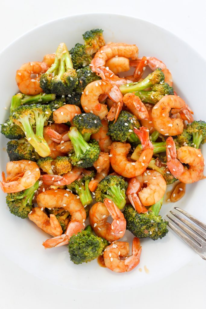 Spicy shrimp and broccoli stir-fry on a serving plate.