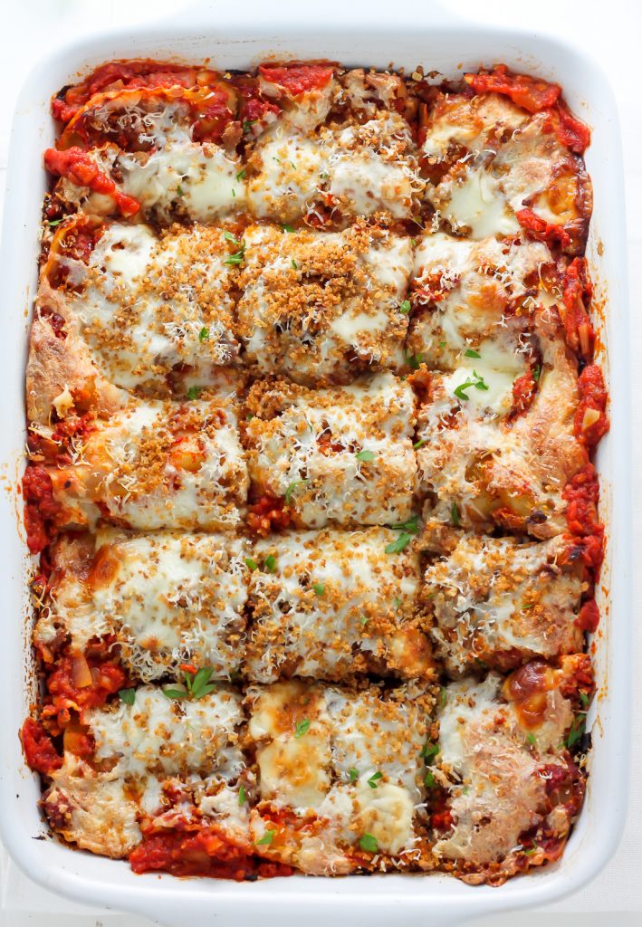 Lightened Up Chicken Parmesan Lasagna - layers of gooey cheese, chicken, sauce, and noodles! THIS IS AMAZING!
