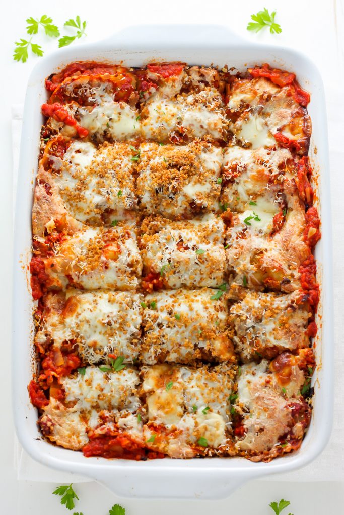 Lightened Up Chicken Parmesan Lasagna - layers of gooey cheese, chicken, sauce, and noodles! THIS IS AMAZING!