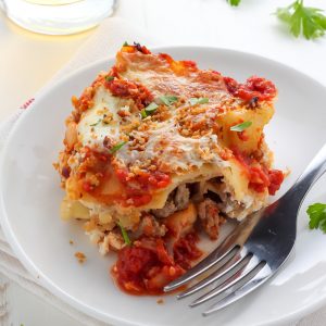 Lightened Up Chicken Parmesan Lasagna - layers of gooey cheese, chicken, sauce, and noodles! THIS IS AMAZING!