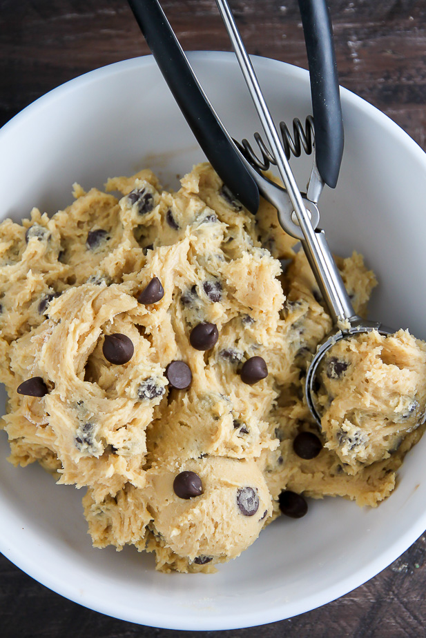Chocolate chip cookie dough recipe in a white bowl.