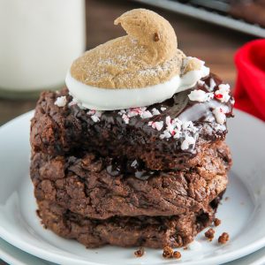 You're going to love these Peppermint Hot Chocolate Cookies! Topped with a drizzle of rich chocolate ganache, a sprinkle of crushed candy canes, and a hot cocoa and cream flavored peeps marshmallow.