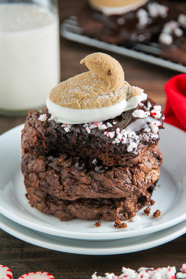 You're going to love these Peppermint Hot Chocolate Cookies! Topped with a drizzle of rich chocolate ganache, a sprinkle of crushed candy canes, and a hot cocoa and cream flavored peeps marshmallow.
