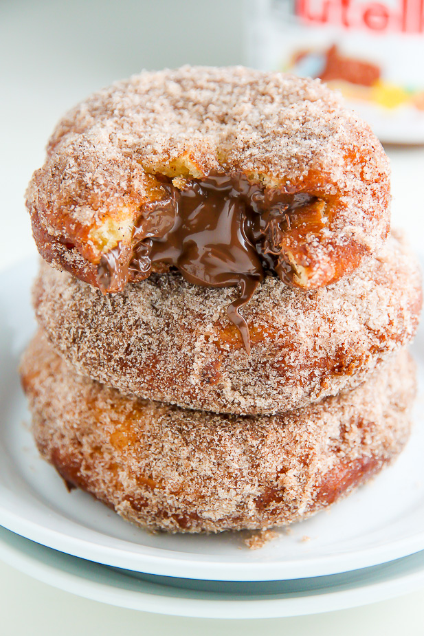 Homemade Cinnamon Sugar Doughnuts stuffed with a dollop of creamy Nutella. The definition of decadence!