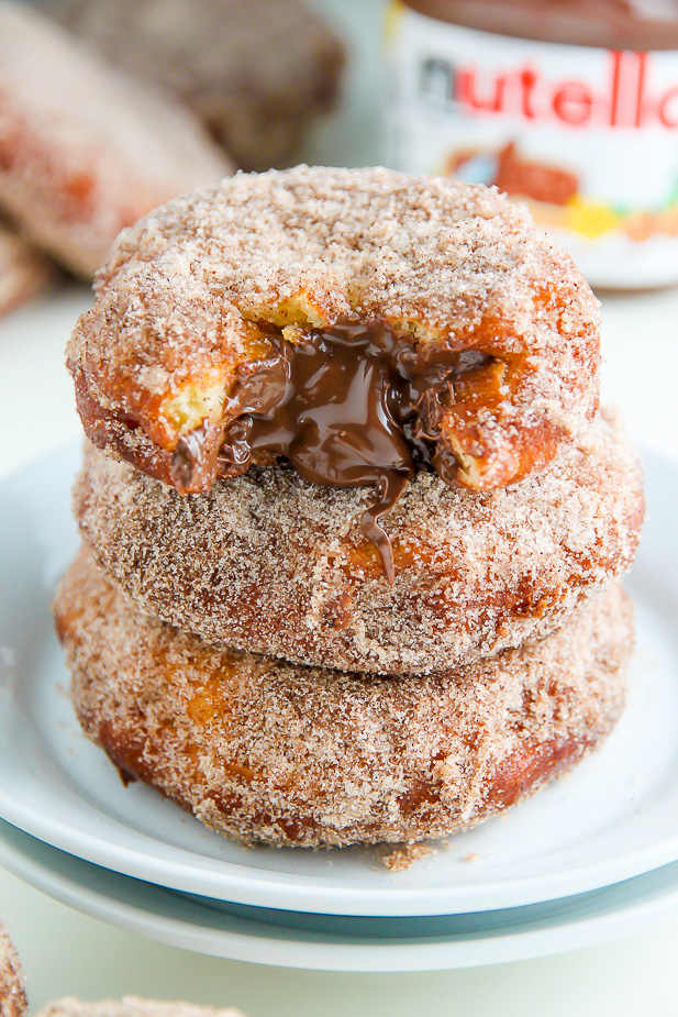 Homemade Cinnamon Sugar Doughnuts stuffed with a dollop of creamy Nutella. The definition of decadence!