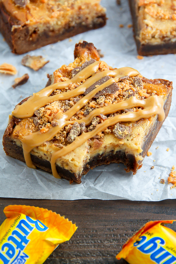If the thought of Creamy Butterfinger Finger Cheesecake Brownies drizzled with peanut butter glaze makes you weak at the knees, this post is going to rock your life.