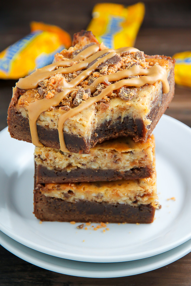 If the thought of Creamy Butterfinger Finger Cheesecake Brownies drizzled with peanut butter glaze makes you weak at the knees, this post is going to rock your life.