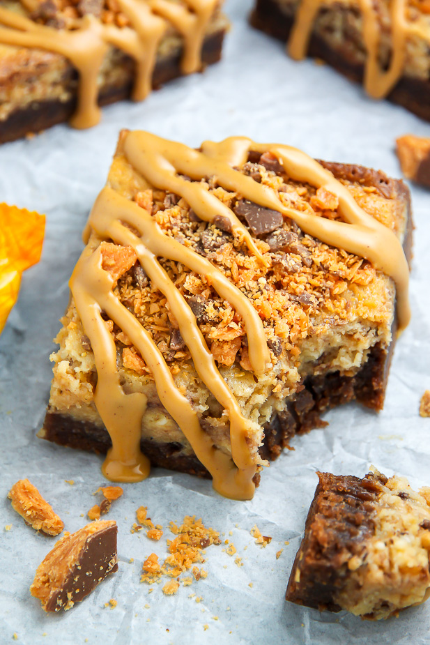If the thought of Creamy Butterfinger Finger Cheesecake Brownies drizzled with peanut butter glaze makes you weak at the knees, this post is going to rock your life.