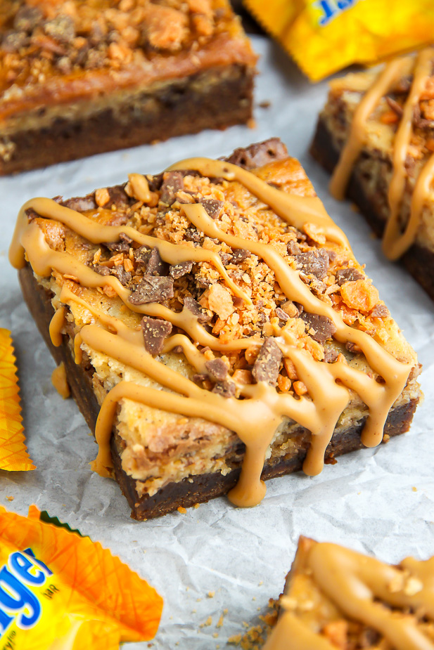 If the thought of Creamy Butterfinger Finger Cheesecake Brownies drizzled with peanut butter glaze makes you weak at the knees, this post is going to rock your life.