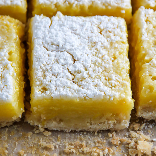 Sunny Lemon Squares feature a crunchy coconut crust, creamy lemon filling, and sprinkle of sweet sugar on top. YUM.