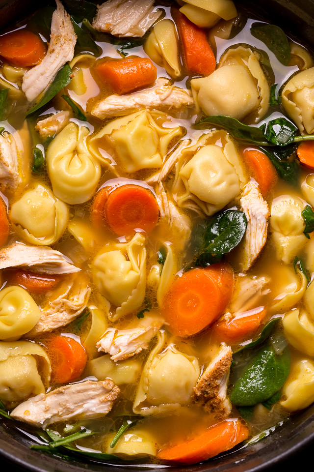 Nothing screams cozy like a giant bowl of Italian Chicken Tortellini Soup! Loaded with tender cheese tortellini, shredded chicken, fresh baby spinach, carrots, and celery... all in a super flavorful chicken broth! Serve this family favorite with extra parmesan cheese and crusty bread.