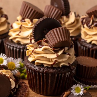 Have a peanut butter lover in your life? You have to bake them these Ultimate Chocolate Peanut Butter Cupcakes! Featuring moist chocolate cupcakes that are stuffed with a peanut butter cup, topped with peanut butter frosting, milk chocolate peanut butter ganache, and chopped peanuts, these are always a crowd-pleaser!