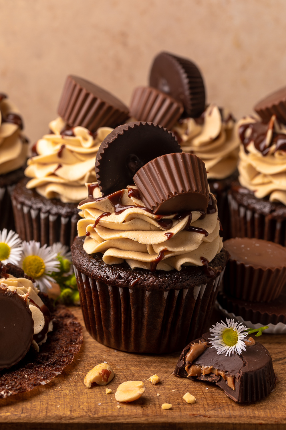 Have a peanut butter lover in your life? You have to bake them these Ultimate Chocolate Peanut Butter Cupcakes! Featuring moist chocolate cupcakes that are stuffed with a peanut butter cup, topped with peanut butter frosting, milk chocolate peanut butter ganache, and chopped peanuts, these are always a crowd-pleaser!
