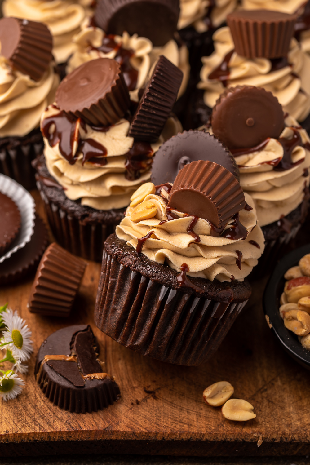 Have a peanut butter lover in your life? You have to bake them these Ultimate Chocolate Peanut Butter Cupcakes! Featuring moist chocolate cupcakes that are stuffed with a peanut butter cup, topped with peanut butter frosting, milk chocolate peanut butter ganache, and chopped peanuts, these are always a crowd-pleaser!