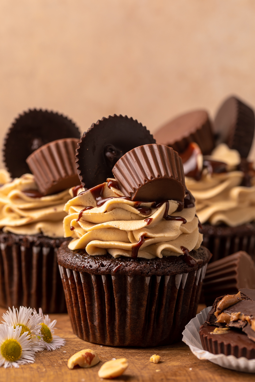 Have a peanut butter lover in your life? You have to bake them these Ultimate Chocolate Peanut Butter Cupcakes! Featuring moist chocolate cupcakes that are stuffed with a peanut butter cup, topped with peanut butter frosting, milk chocolate peanut butter ganache, and chopped peanuts, these are always a crowd-pleaser!