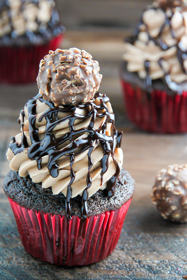 Triple Chocolate Nutella Cupcakes topped with silky chocolate ganache and a chocolate hazelnut truffle.