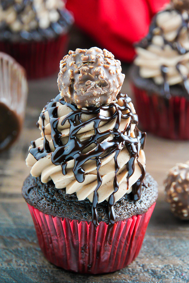 Triple Chocolate Nutella Cupcakes topped with silky chocolate ganache and a chocolate hazelnut truffle.