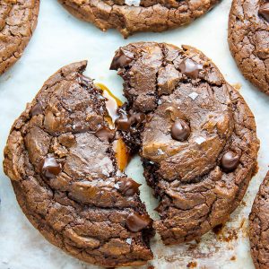 Soft Batch Chocolate Fudge Cookies with a gooey pocket of salted caramel inside! Pure decadence.
