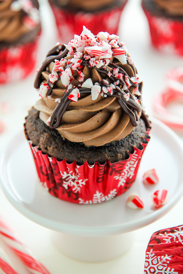 Supremely moist and decadent chocolate cupcakes topped with peppermint mocha frosting, a drizzle of chocolate ganache, and crushed candy canes.
