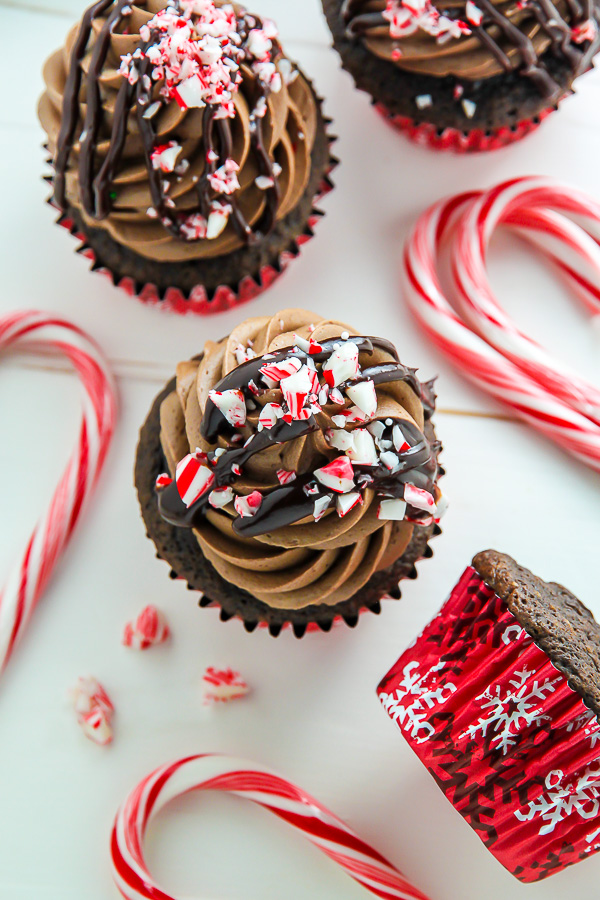 Supremely moist and decadent chocolate cupcakes topped with peppermint mocha frosting, a drizzle of chocolate ganache, and crushed candy canes.