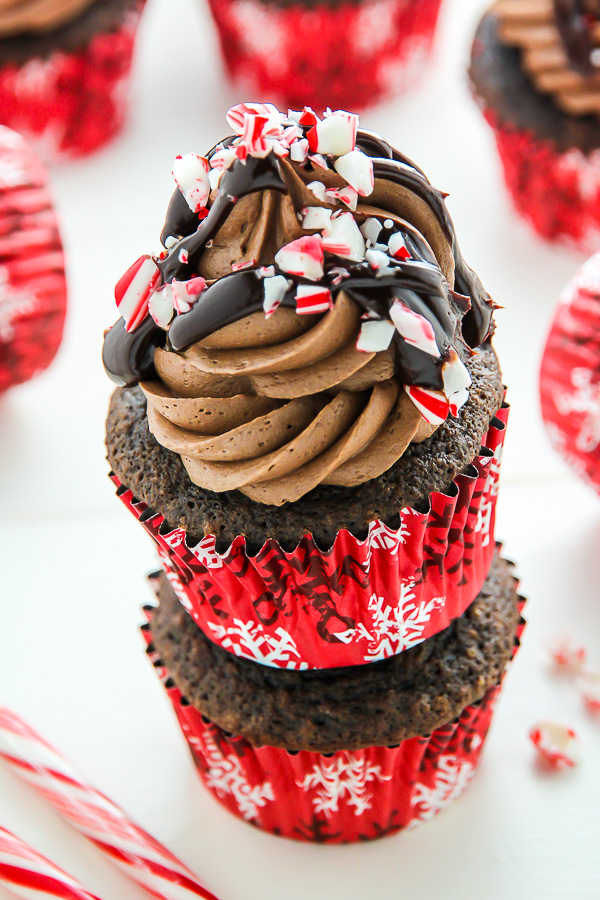 Supremely moist and decadent chocolate cupcakes topped with peppermint mocha frosting, a drizzle of chocolate ganache, and crushed candy canes.