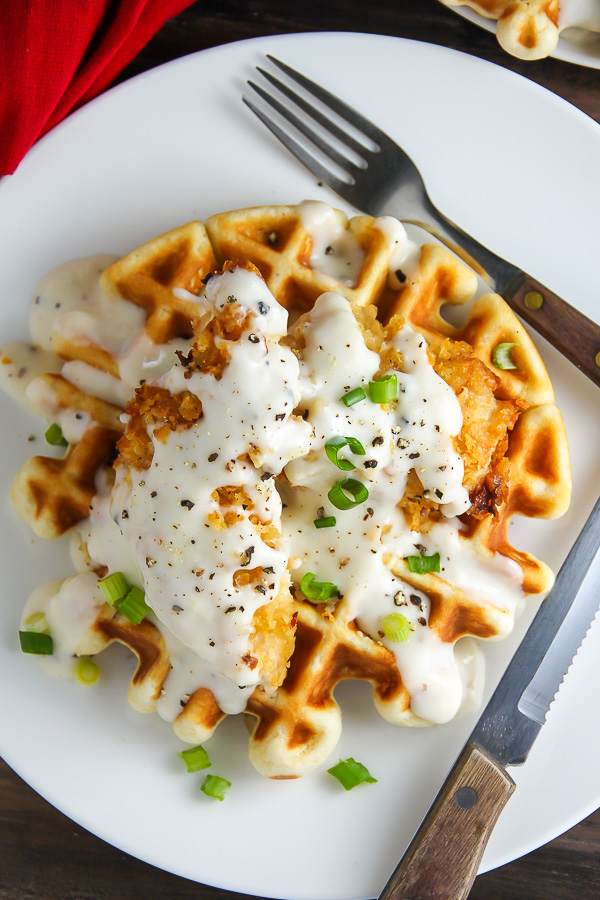 Fluffy buttermilk waffles topped with crispy "oven-fried" chicken and creamy white pepper gravy. Brunch perfection.