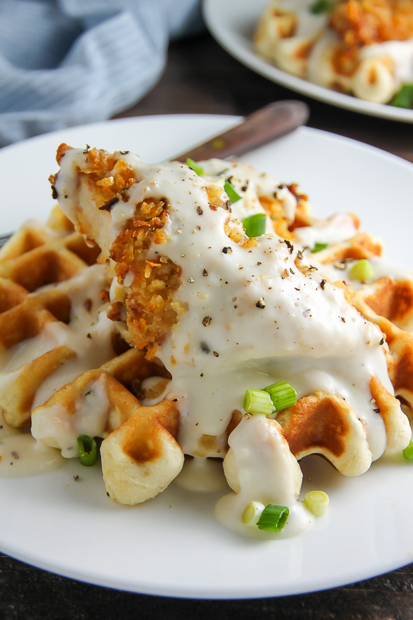 Fluffy buttermilk waffles topped with crispy "oven-fried" chicken and creamy white pepper gravy. Brunch perfection.