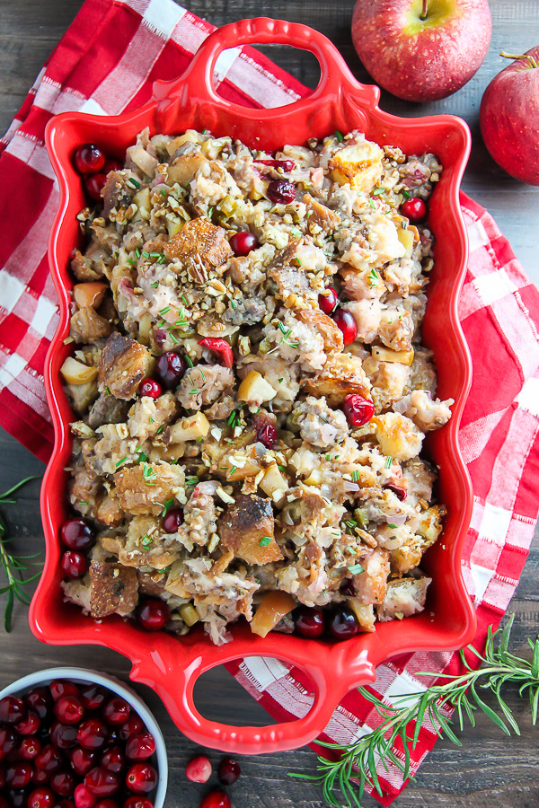 My go-to holiday stuffing recipe loaded with fresh herbs, chopped apples, cranberries, and sausage! Bonus: This recipe can be made ahead to help you save time.