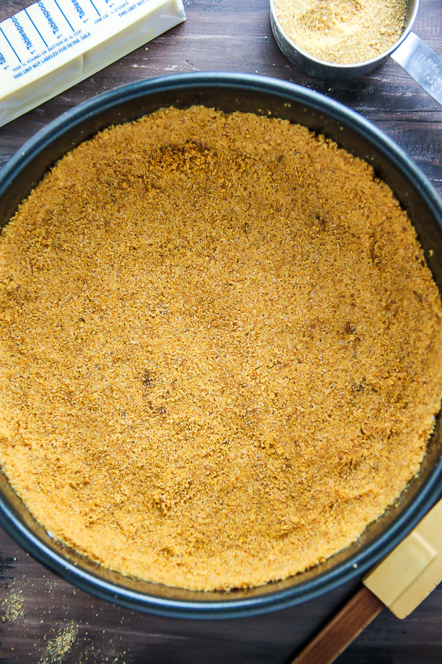 Supremely smooth and creamy homemade Lemon cheesecake topped with fresh Blueberry swirls. All layered on top of a buttery homemade graham cracker crust.