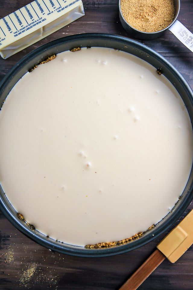 Supremely smooth and creamy homemade Lemon cheesecake topped with fresh Blueberry swirls. All layered on top of a buttery homemade graham cracker crust.