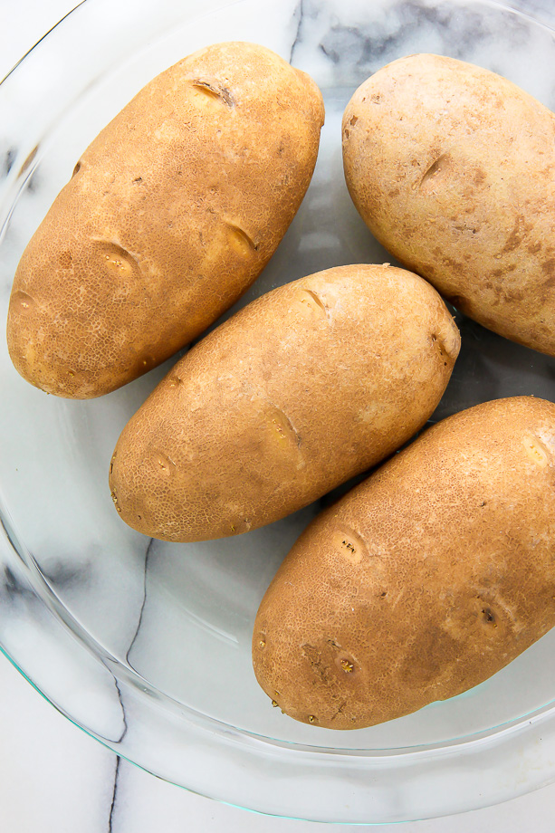 Russet potatoes in a baking dish.