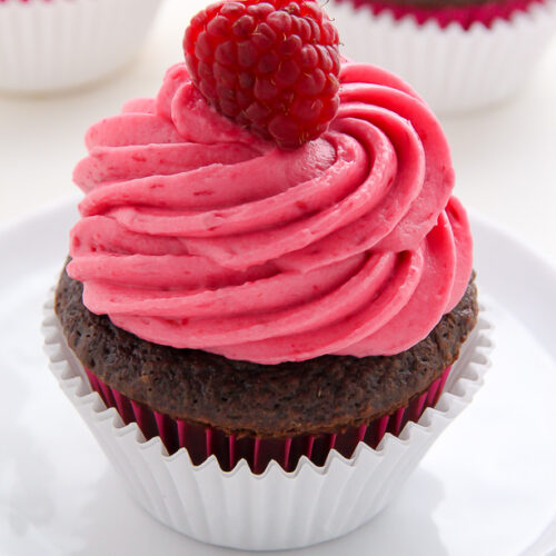 Decadent chocolate cupcakes stuffed with creamy nutella and topped with fresh raspberry frosting.