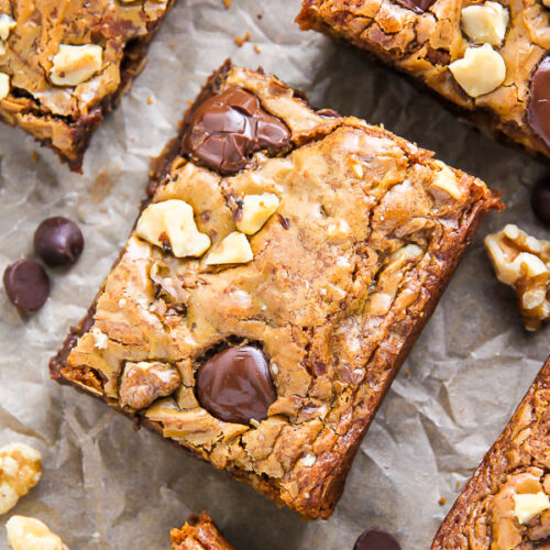 Ultra thick and chewy brown butter blondies loaded with toasted walnuts and plenty of chocolate chips! They're practically begging to be served with a cold glass of milk.