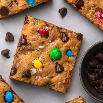 These thick and chewy Brown Butter M&M Blondies are irresistible! An easy cookie bar that's loaded with chocolate chips and M&M candies. Loved by kids and adults, this blondie recipe is always a crowd pleaser!