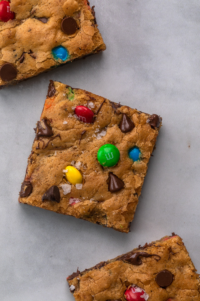 These thick and chewy Brown Butter M&M Blondies are irresistible! An easy cookie bar that's loaded with chocolate chips and M&M candies. Loved by kids and adults, this blondie recipe is always a crowd pleaser!