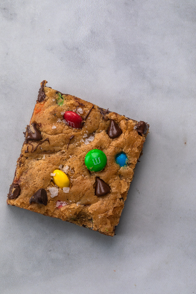 These thick and chewy Brown Butter M&M Blondies are irresistible! An easy cookie bar that's loaded with chocolate chips and M&M candies. Loved by kids and adults, this blondie recipe is always a crowd pleaser!