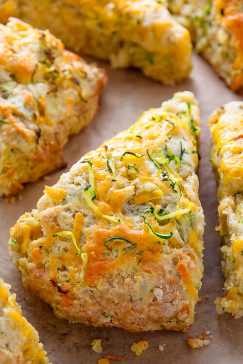 My favorite savory scone recipe loaded with sharp cheddar cheese and fresh zucchini! Who knew veggies could taste this good!?