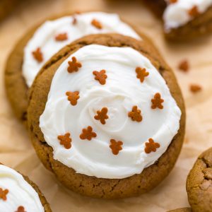 Gingerbread cookies with cream cheese and gingerbread man sprinkles on top.