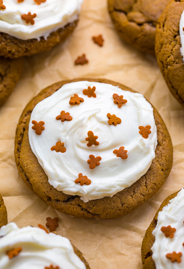 A gingerbread cookie with cream cheese frosting on top.