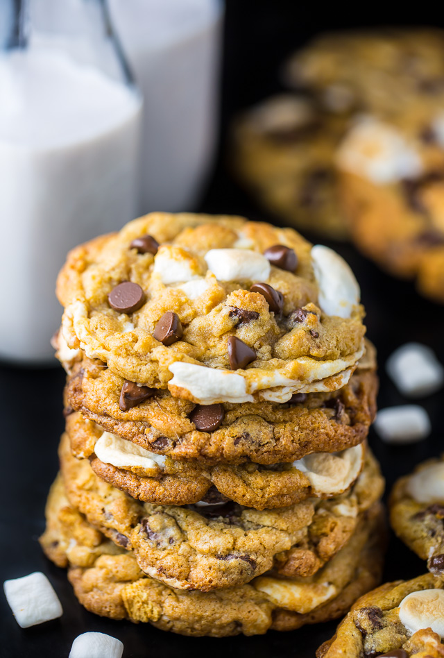 Pile of cookies with milk on the side.