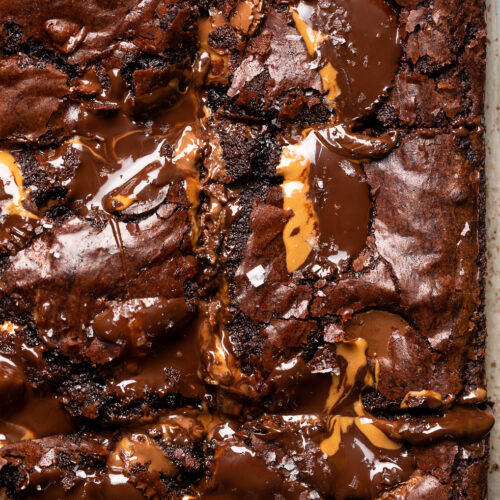 Whenever I find peanut butter cups on sale, I stockpile them so I can make my Peanut Butter Cup Brownies! They're rich, fudge, and so decadent! If you love the combination of chocolate and peanut butter, this is the brownie recipe for you!