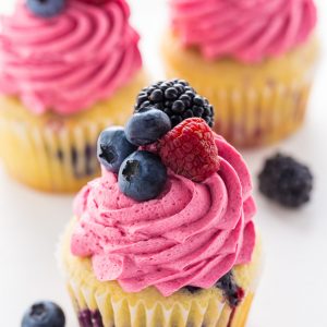These Triple Berry Cupcakes are moist, fluffy, and bursting with fresh fruit in every bite.