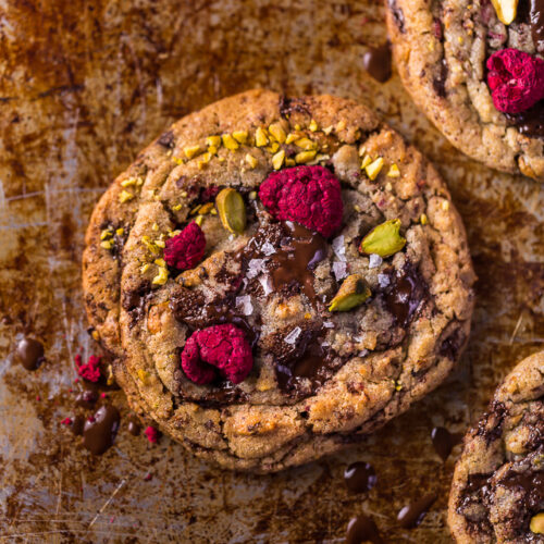 These Raspberry Pistachio Chocolate Chunk Cookies are thick, chewy, and so flavorful! Bonus: they're super pretty, too!